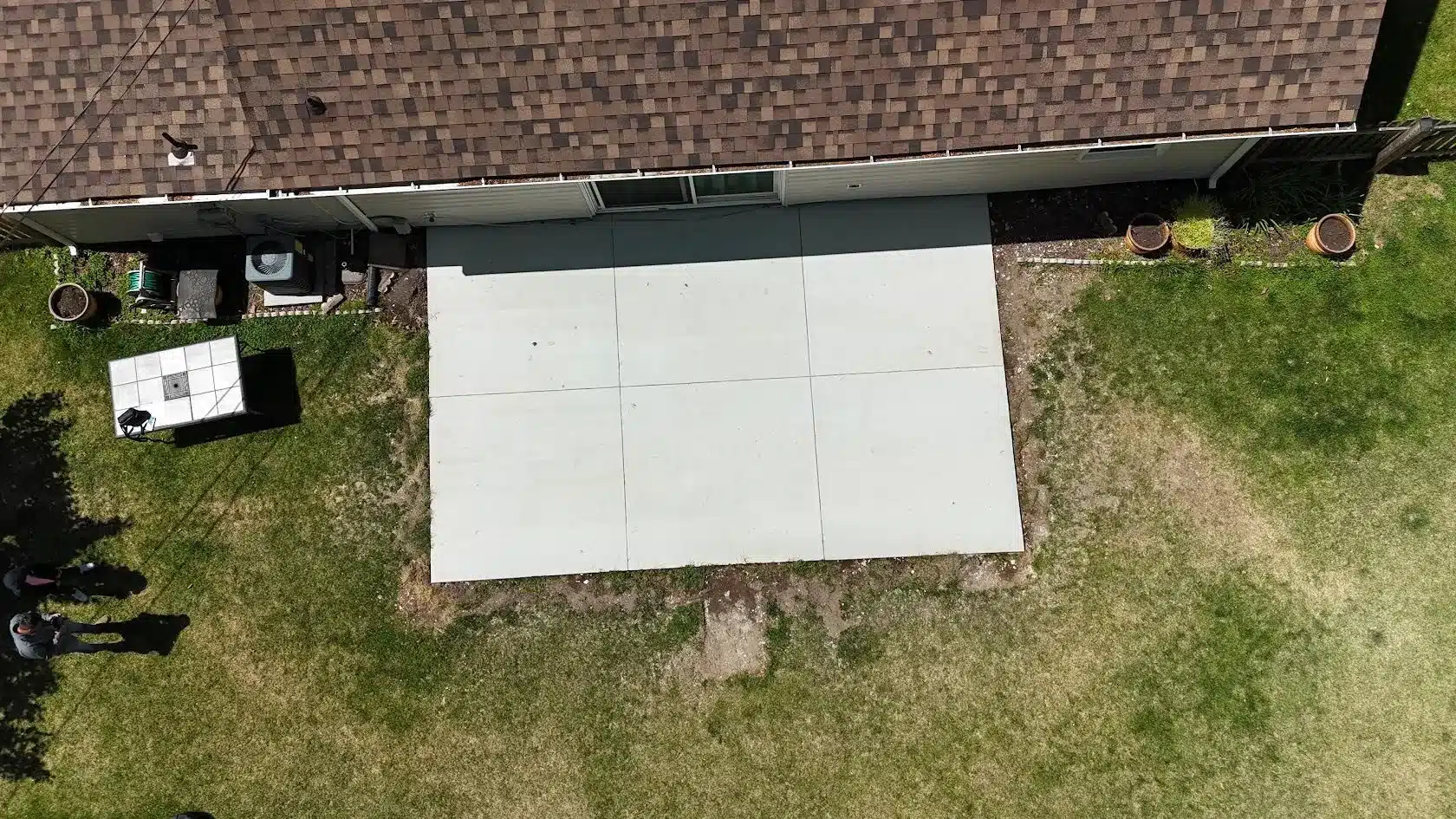 Poured concrete patio with drainage pitch on a Maryland home