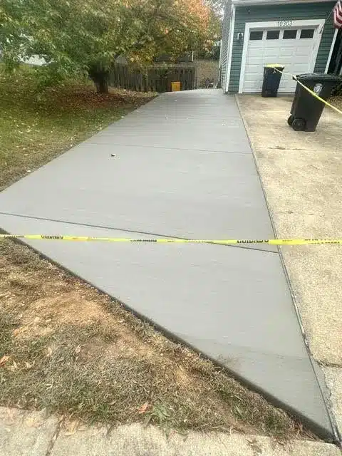 Fresh concrete pour being placed and screeded